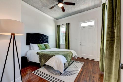 a bedroom with a bed and a ceiling fan at Mid-City 3BR w Pool Balcony Near Streetcar & FQ in New Orleans