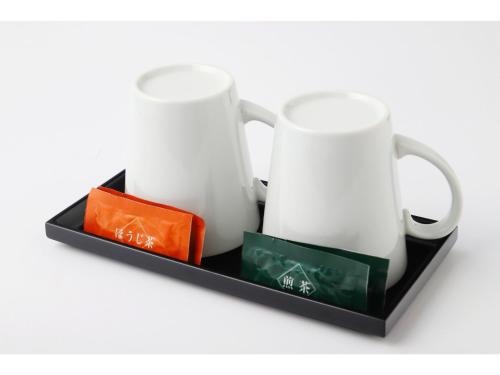 two white mugs on a black tray at Smile Hotel Kyoto Shijo - Vacation STAY 69790v in Kyoto