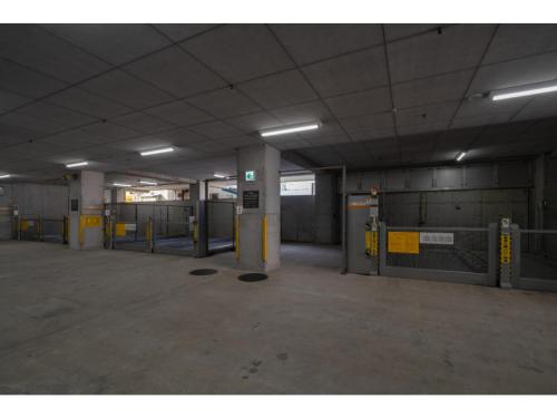 an empty parking garage with a bunch of machines at HOTEL enoe Hakodate - Vacation STAY 78527v in Hakodate