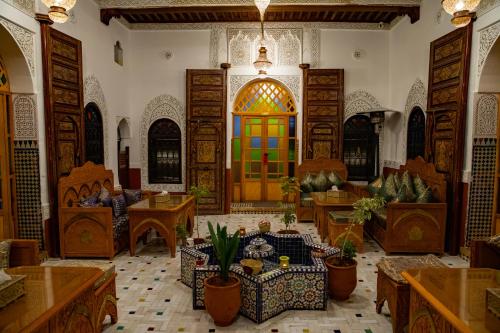 a large room with a colorful door in a building at Riad Hikaya - Fes Story in Fès
