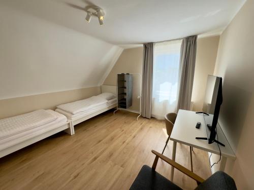 Ένα ή περισσότερα κρεβάτια σε δωμάτιο στο Grafen Apartment Hallermunt