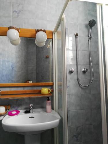 a bathroom with a sink and a shower at La Vila in Villajoyosa