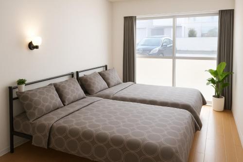 Giường trong phòng chung tại Eminent House - Vacation STAY 19597