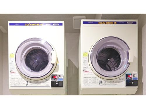 two washing machines are sitting next to each other at Smile Hotel Shonan Fujisawa - Vacation STAY 74506v in Fujisawa