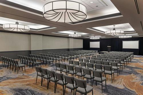 a large room with rows of chairs and a stage at Sheraton Boston Hotel in Boston