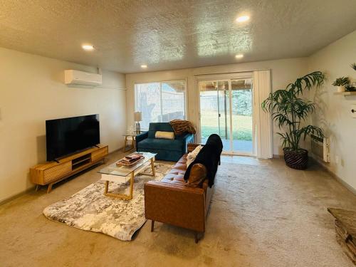 a living room with a dog laying on a couch at Siesta Sunset in Boise
