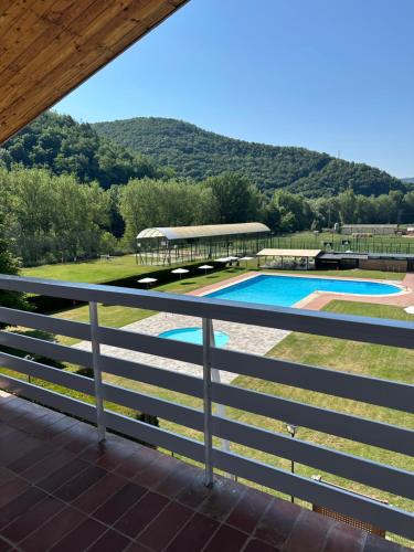 a view from the balcony of a house with a swimming pool at Hotel Solana del Ter in Ripoll