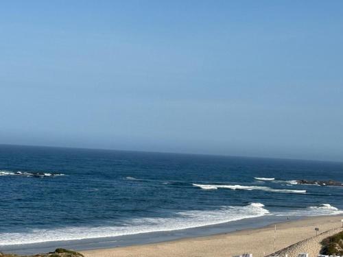 a view of the ocean from a beach at Apartamento LUZ DA PRAIA in Vila Chã