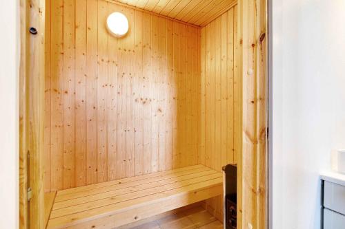 a wooden sauna with a wooden floor at Idyllic Holiday Home By Beach And Nature in Bro