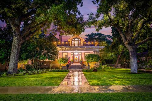 a house with a pathway leading to the front yard at Sophie's Gasthaus - Luxury Boutique Hotel in Downtown New Braunfels in New Braunfels