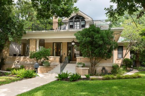 a house with a balcony on top of it at Sophie's Gasthaus - Luxury Boutique Hotel in Downtown New Braunfels in New Braunfels