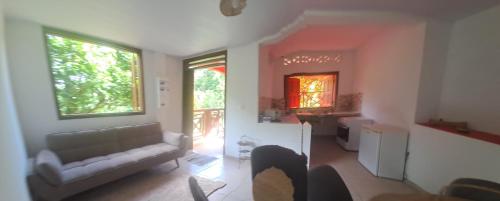 a living room with a couch and a table at kaz a roura in Roura