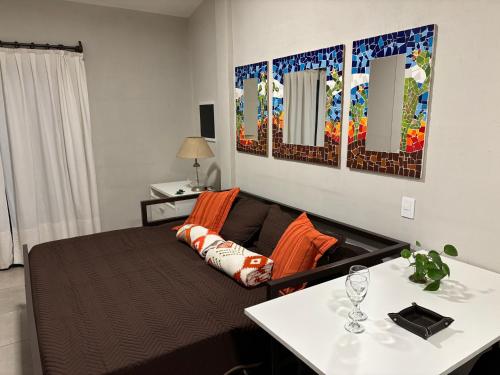 a living room with a couch and a table at Loto San Lorenzo Studio I balcón, vista cerros y piscina in San Lorenzo