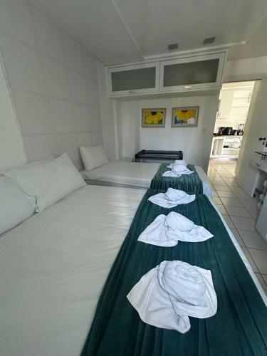 Postel nebo postele na pokoji v ubytování Marulhos Muro Alto, Apartamento Encantador