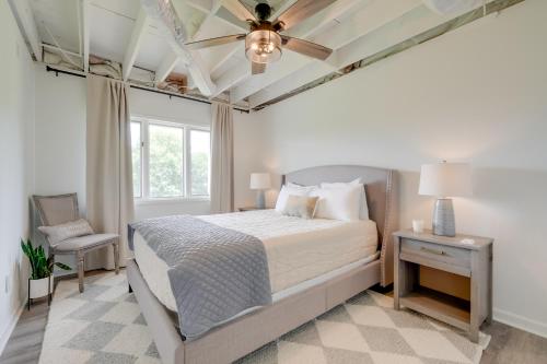 a bedroom with a bed and a ceiling fan at Less Than 1 Mi to Lake Chatuge Home with Mtn and Water Views! in Young Harris