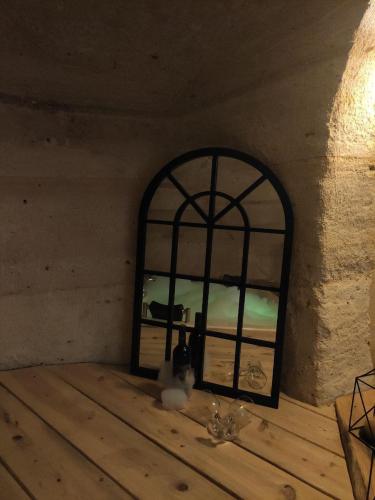 a window in a room with a table at DEEP CAVE House in Urgup