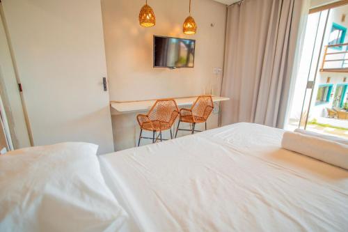 Postel nebo postele na pokoji v ubytování Studio Zen - Hidromassagem -Vista Mar-Area Gourmet