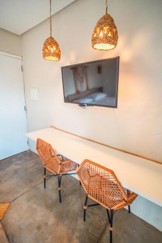 TV a/nebo společenská místnost v ubytování Studio Zen - Hidromassagem -Vista Mar-Area Gourmet