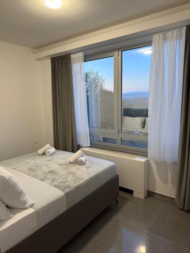 Ένα ή περισσότερα κρεβάτια σε δωμάτιο στο View Apartments Međugorje