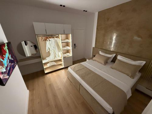 Postel nebo postele na pokoji v ubytování Montflux Hotel