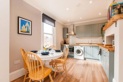 a kitchen and dining room with a table and chairs at The Old Chemist - Viking Bay Getaway in Broadstairs