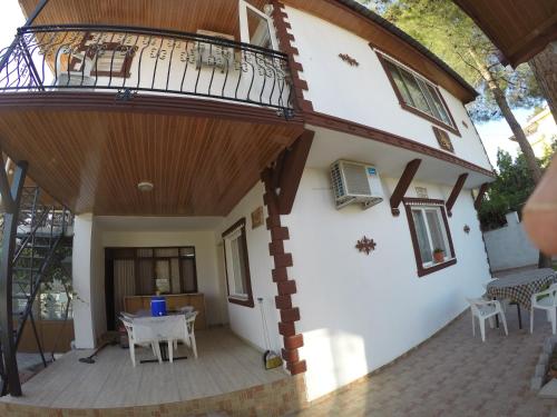 a view of the outside of a house with a balcony at Pınar Vintage House in Pamukkale