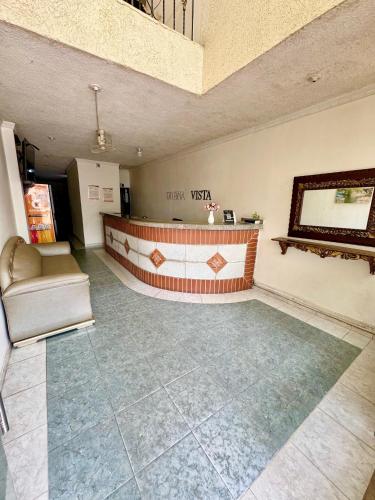 a lobby with a reception desk in a building at Hotel Buenavista Valledupar in Valledupar