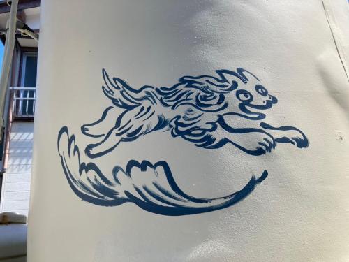 a drawing of a horse on the side of a building at Yado KONAMI in Shimoda