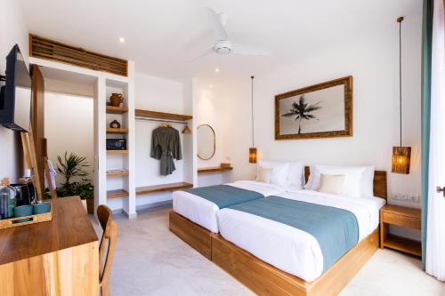 Ένα ή περισσότερα κρεβάτια σε δωμάτιο στο Sikara Lombok Hotel