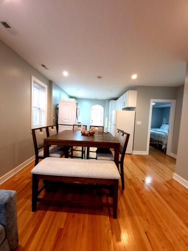 a dining room with a table and chairs at Beautiful 4 bedroom 2 bathroom apartment near everything in Chicago