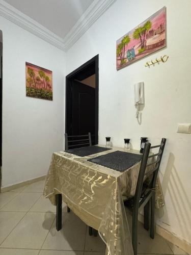 a table in a room with a table cloth on it at alojamiento en tanger bab Andaluz 3 in Tangier