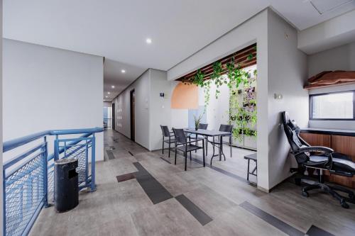 a dining room with a table and chairs at RedDoorz Plus near Radio Dalam 3 in Jakarta