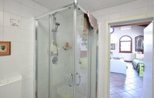 a bathroom with a shower with a glass door at Beautiful Home In Udine With House A Panoramic View in Udine