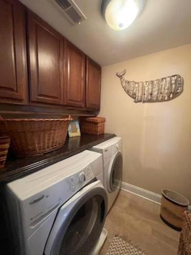 a laundry room with a washing machine in a kitchen at Oceanside Beach Badges Private Yard Wifi Deck Patio Stunning Ocean Side Home In Brant Beach 2Nd Fl Master Suite Has Private Os Shower 13029 in Brant Beach