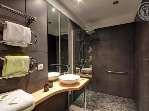 a bathroom with a sink and a shower at Gîte avec Spa et Terrasse au cœur du Pilat - FR-1-496-340 in Saint-Genest-Malifaux