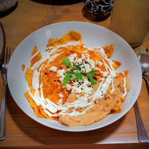 a plate of food with pasta on a table at Casa Axixic in Ajijic