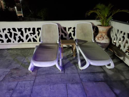 two chairs and a table on a patio at Bayview Luxury Retreat 