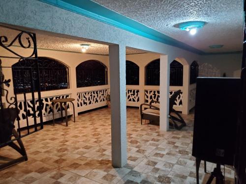 a room with a table and chairs in a room at Bayview Luxury Retreat 