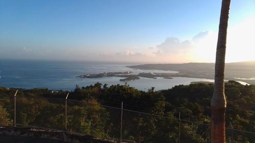 a view of the ocean from the top of a mountain at Bayview Luxury Retreat 