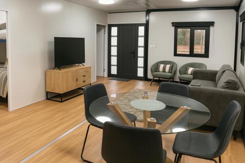 a living room with a couch and a table and chairs at Mansfield Holiday Park in Mansfield