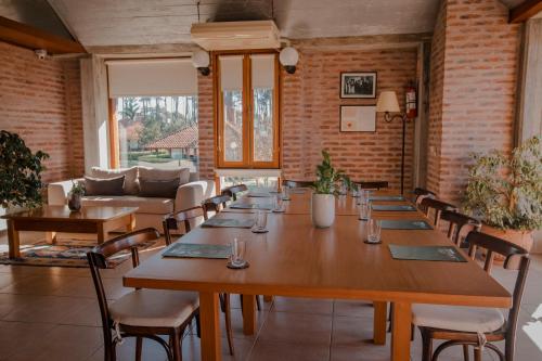 a large room with a long table and chairs at Il Belvedere in Punta del Este