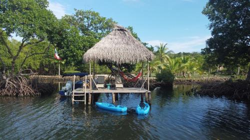a dock with inflatable boats in a body of water at Big Bay Bocas - Casita Margarita 