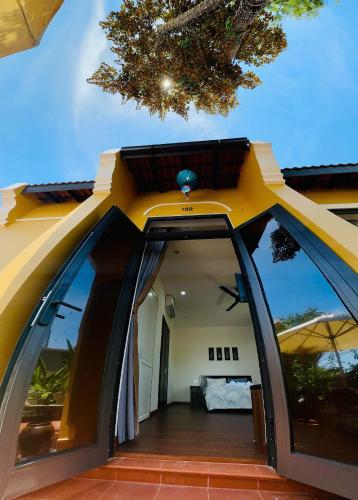 an open door to a house with a roof at Laa House in Hoi An