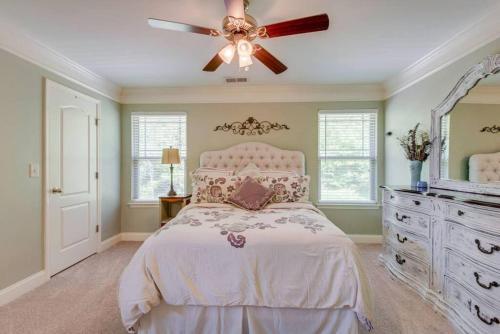 a bedroom with a bed and a ceiling fan at Cheerful Nashville Home In Hip Westmeade! in Nashville