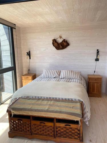 a bedroom with a large bed in a room at Calm and beautiful beach in Pichilemu