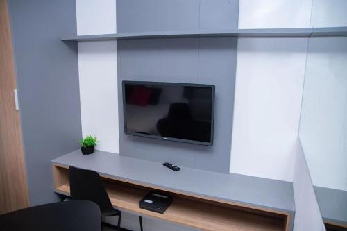 On Loefgreen - Academia e localização privilegiadaにあるテレビまたはエンターテインメントセンター