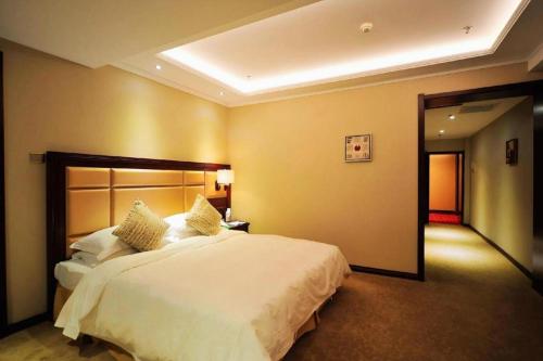 Katil atau katil-katil dalam bilik di Changchun Global Hotel