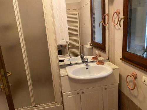 a bathroom with a sink and a mirror at Annina residence in Ravenna