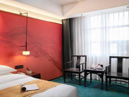 Postel nebo postele na pokoji v ubytování Dengfeng Chanwu Hotel