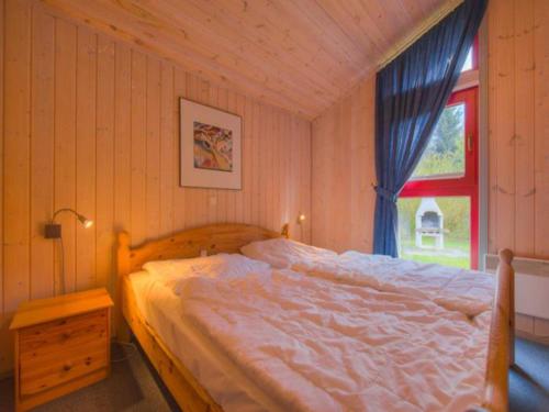 Postel nebo postele na pokoji v ubytování Ferienhaus mit Sauna im Ferienpark Mirow